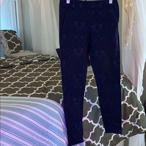 Blue floral fabric trousers.